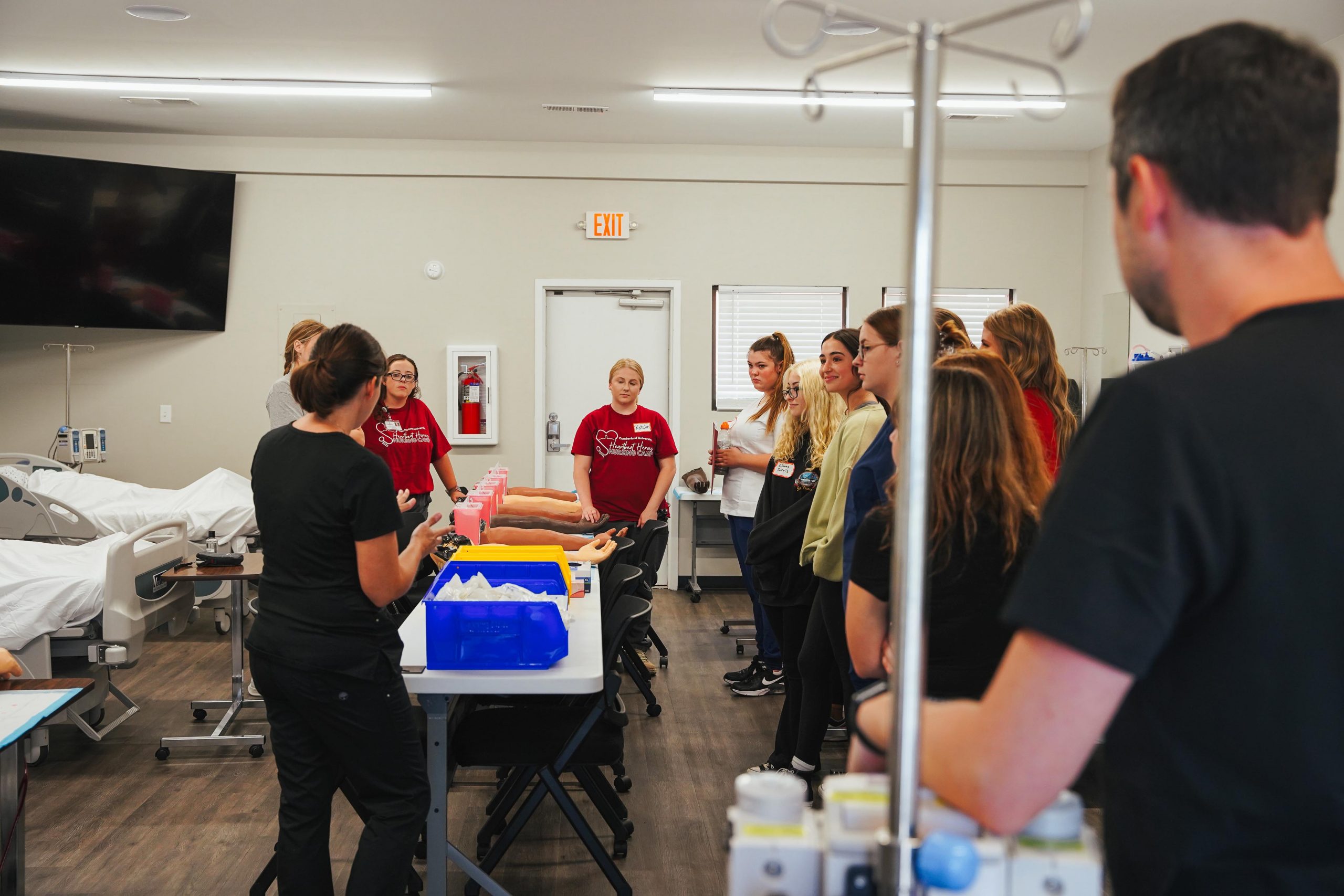 Cumberland faculty introduce students to the IV station during Heartbeat Heroes Nursing Camp